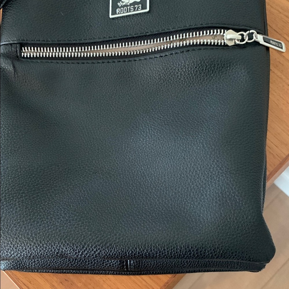 Roots Black Crossbody with Leather Material and Sleek Design